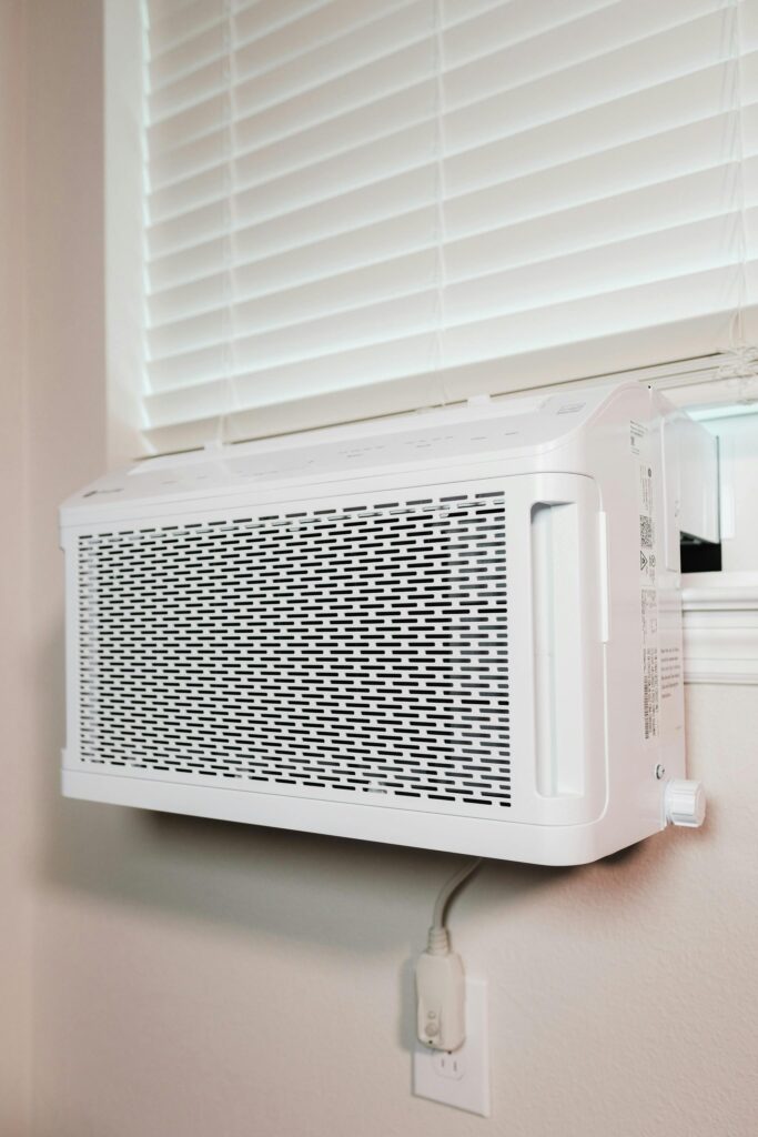 pexels photo 16592625 16592625 Wall-mounted air conditioner installed in a residential setting, providing cooling comfort.